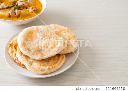 Chicken curry soup with roti Chicken curry soup with roti 111662258