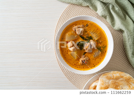 Chicken curry soup with roti Chicken curry soup with roti 111662259