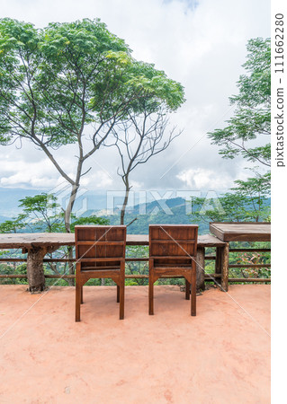 wood bar and chair with mountain hill background 111662280