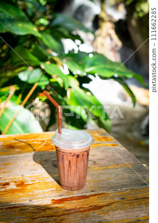 iced chocolate milkshake on table 111662285