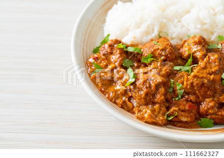chicken tikka masala with rice on plate 111662327