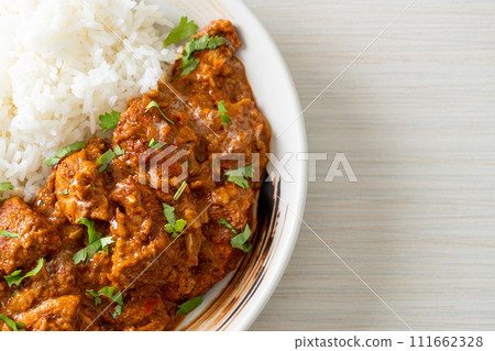 chicken tikka masala with rice on plate chicken tikka masala with rice on plate 111662328