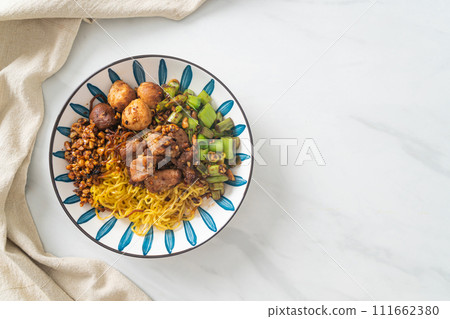 dried egg noodle with pork and meatball 111662380