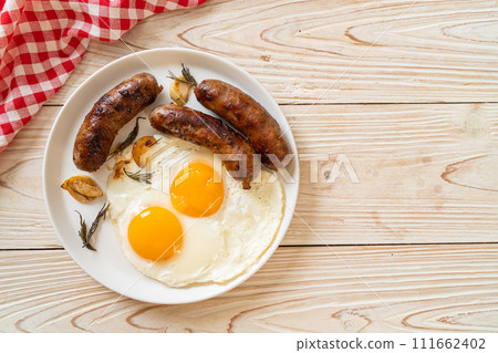 double fried egg with pork sausage 111662402
