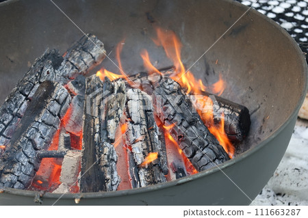 View of piled up snow and bonfire 111663287