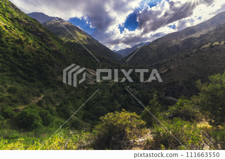 panorama with a view of green gorge in the Tien Shan mountains in summer in Kazakhstan in Aksu-Dzhabagly Nature Reserve panorama with a view of green gorge in the Tien Shan mountains in summer in Kazakhstan in Aksu-Dzhabagly Nature Reserve 111663550