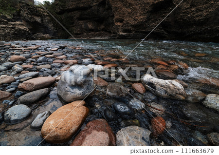 stones in mountain river in mountains in Aksu canyon in Kazakhstan 111663679