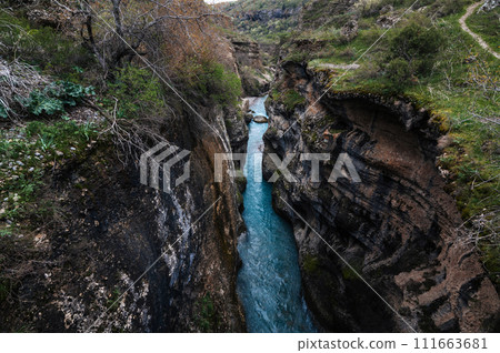 blue water in river in mountains in Aksu canyon in Kazakhstan in spring blue water in river in mountains in Aksu canyon in Kazakhstan in spring 111663681