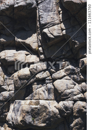 texture of surface of gray rocky mountain with cracks close-up texture of surface of gray rocky mountain with cracks close-up 111663760