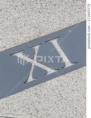 Roman numerical number eleven made of stone tiles on street Roman numerical number eleven made of stone tiles on street 111665578