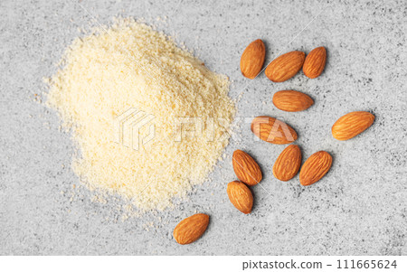Fresh almond flour  and almonds 111665624