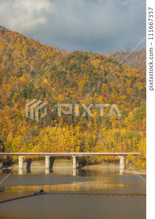 Japan: Lake Sapporo, an artificial lake created by Jozankei Dam in Minami Ward, Sapporo City, Hokkaido, and autumn leaves Japan: Lake Sapporo, an artificial lake created by Jozankei Dam in Minami Ward, Sapporo City, Hokkaido, and autumn leaves 111667357