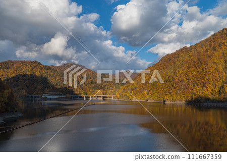 Japan: Lake Sapporo, an artificial lake created by Jozankei Dam in Minami Ward, Sapporo City, Hokkaido, and autumn leaves Japan: Lake Sapporo, an artificial lake created by Jozankei Dam in Minami Ward, Sapporo City, Hokkaido, and autumn leaves 111667359
