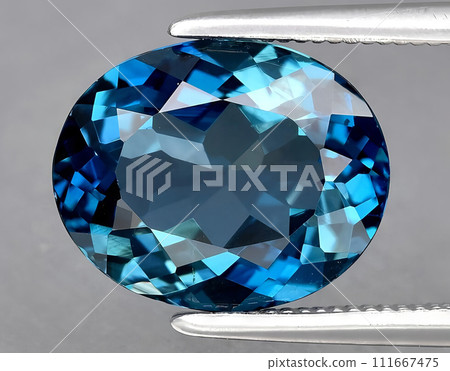 natural blue london topaz on the background natural blue london topaz on the background 111667475