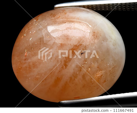 natural orange sunstone gem on the background 111667491