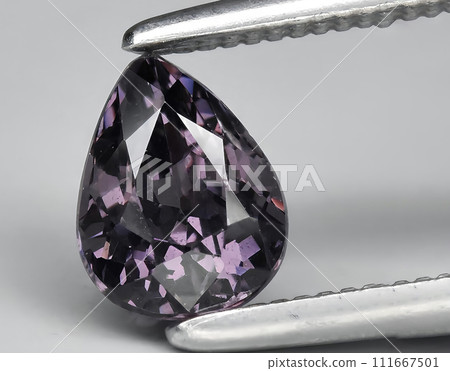 natural purple spinel gem on the background 111667501