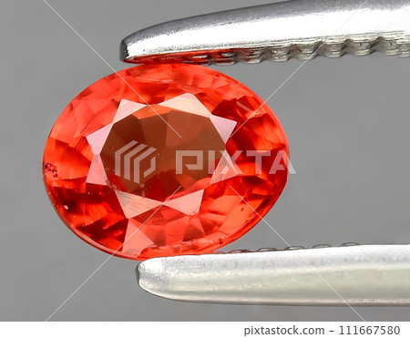 natural orange padparadscha sapphire gem on the background 111667580