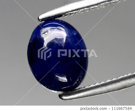 natural green blue sapphire gem on the background natural green blue sapphire gem on the background 111667584