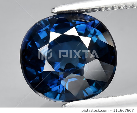 natural green blue sapphire gem on the background natural green blue sapphire gem on the background 111667607