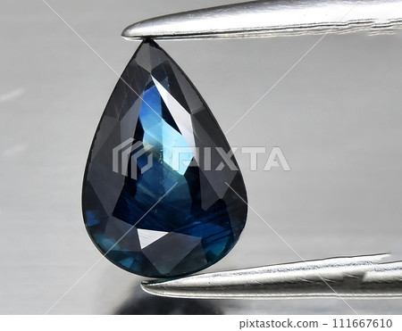natural green blue sapphire gem on the background natural green blue sapphire gem on the background 111667610