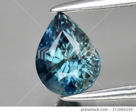natural green blue sapphire gem on the background 111668183