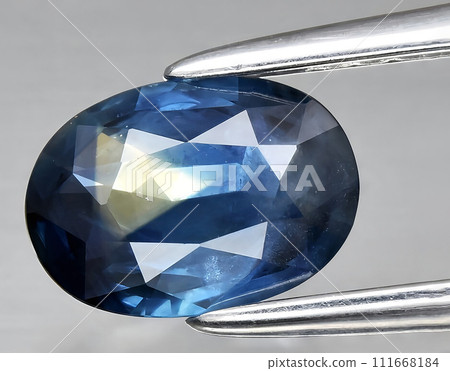 natural green blue sapphire gem on the background 111668184