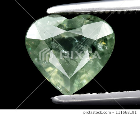 natural green sapphire gem on the background natural green sapphire gem on the background 111668191