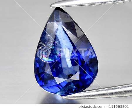 natural blue sapphire gem on the background natural blue sapphire gem on the background 111668201