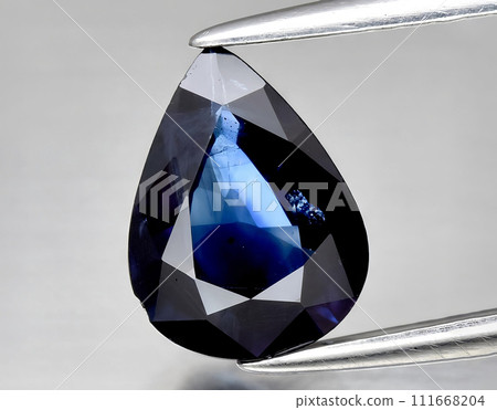 natural blue sapphire gem on the background natural blue sapphire gem on the background 111668204