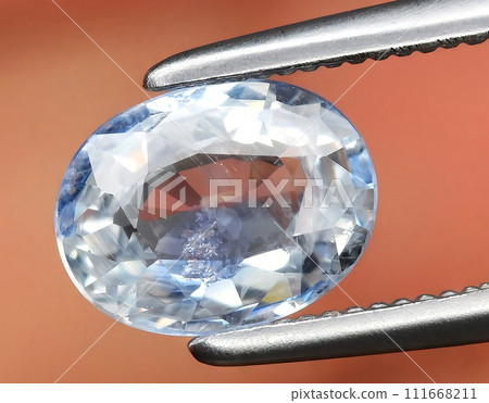 natural blue sapphire gem on the background 111668211