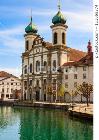 View of Jesuit church and the Reuss river in Lucerne, Switzerland 111668274