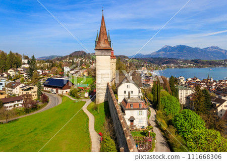 Top view on Lake Lucerne and old town with Musegg wall and towers in Lucerne city, Switzerland Top view on Lake Lucerne and old town with Musegg wall and towers in Lucerne city, Switzerland 111668306