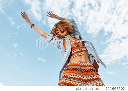 Happy Smiling Woman Dancing on the Beach, Embracing Freedom and Joy 111668502