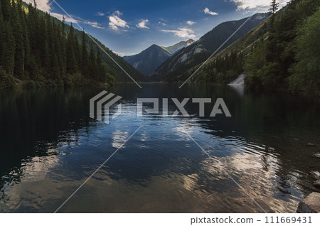 landscape with Lake Kolsay in Tien Shan mountains in Kazakhstan in summer landscape with Lake Kolsay in Tien Shan mountains in Kazakhstan in summer 111669431