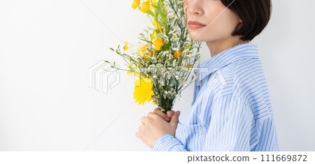 Woman holding flowers, sideways Woman holding flowers, sideways 111669872