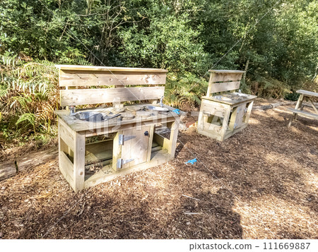 Children outdoor mud kitchen in a forest in County Donegal - Ireland Children outdoor mud kitchen in a forest in County Donegal - Ireland 111669887