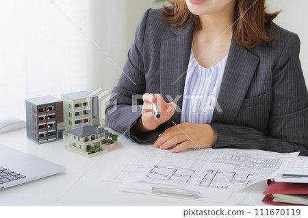 Female salesperson responding to housing consultations Female salesperson responding to housing consultations 111670119