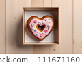 Donut in the shape of a heart. Valentine's Day Gift Concept. 111671160