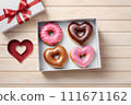 Donut in the shape of a heart. Valentine's Day Gift Concept. 111671162