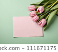 Beautiful pink tulips in craft paper on green pastel background with copy space, spring time, mother's day. 111671175