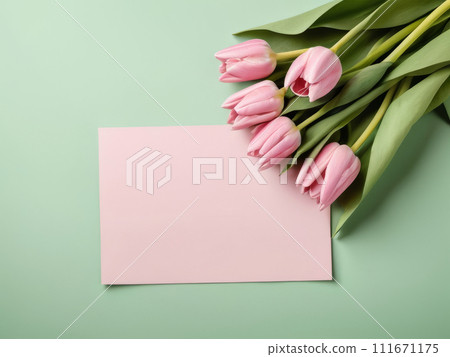Beautiful pink tulips in craft paper on green pastel background with copy space, spring time, mother's day. 111671175