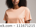 Woman in peach fuzz colored tshirt, can be used for design, mock up. The trending color of 2024. 111671215
