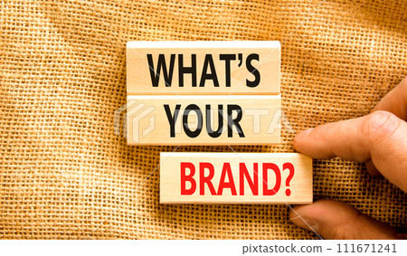 Branding and what is your brand symbol. Concept words What is your brand on beautiful blocks. Beautiful canvas background. Businessman hand. Business branding what is your brand concept. Copy space. Branding and what is your brand symbol. Concept words What is your brand on beautiful blocks. Beautiful canvas background. Businessman hand. Business branding what is your brand concept. Copy space. 111671241