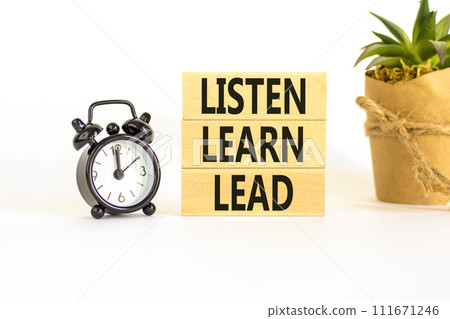 Listen learn lead symbol. Concept word Listen Learn Lead on beautiful wooden block. Black alarm clock. Beautiful white table white background. Business, education listen learn lead concept. Copy space Listen learn lead symbol. Concept word Listen Learn Lead on beautiful wooden block. Black alarm clock. Beautiful white table white background. Business, education listen learn lead concept. Copy space 111671246