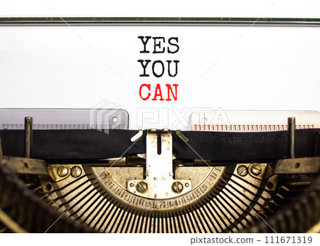 Motivational and Yes you can symbol. Concept words Yes you can typed on beautiful old retro typewriter. Beautiful white paper background. Business motivational and Yes you can concept. Copy space. 111671319