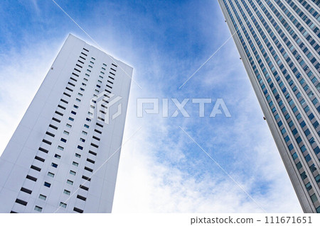 Clouds and skyscrapers in the blue sky Clouds and skyscrapers in the blue sky 111671651