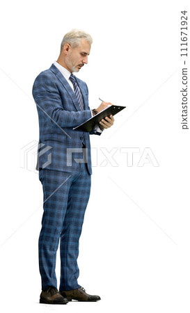 A man, full-length, on a white background, writes 111671924