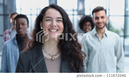 business woman with her staff in background at office business woman with her staff in background at office 111672048