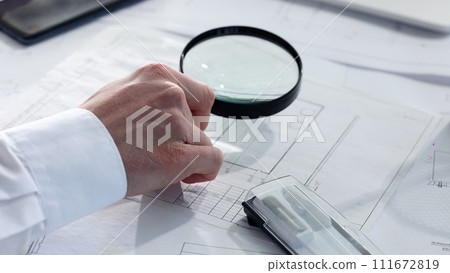 Checking an important business report before a transaction Checking an important business report before a transaction 111672819