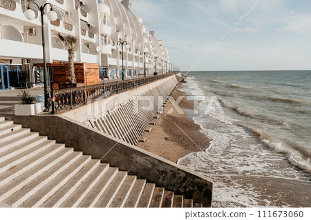 Coastal residential areas with a modern hotel and restaurant complex alongside sandy beaches. Summer holiday vacation and travel concept. 111673060
